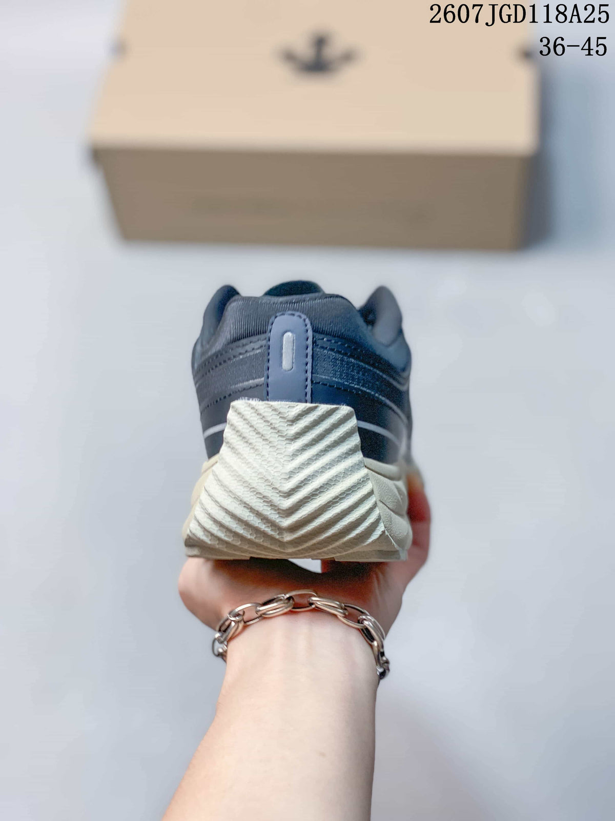 Rear view of the sneaker showing the padded heel collar, heel pull tab, and textured outsole.