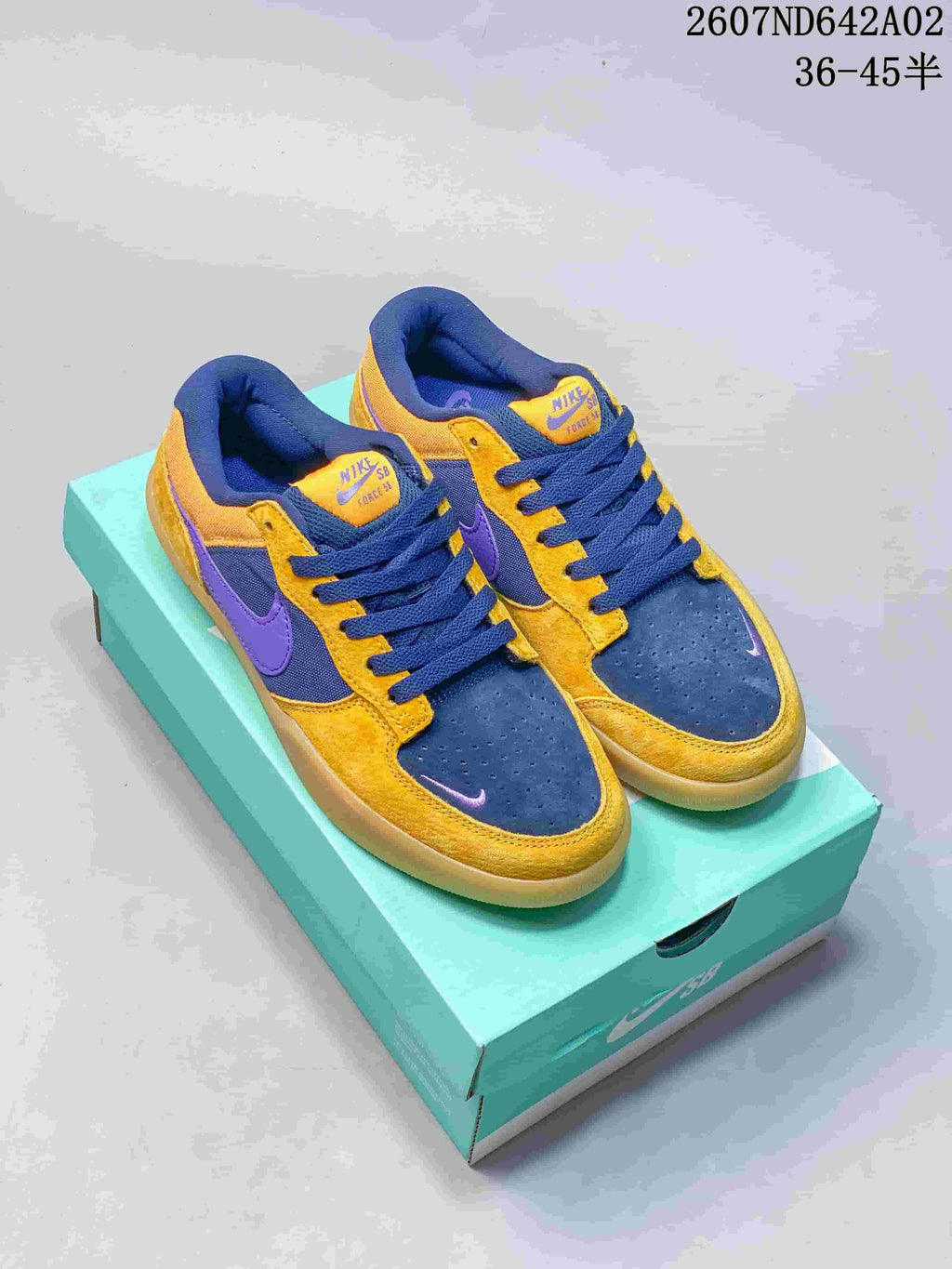 Nike SB Force 58 low-top shoes in yellow, navy, and purple shown on a turquoise shoe box
