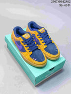 Nike SB Force 58 low-top shoes in yellow, navy, and purple shown on a turquoise shoe box