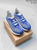 Blue and white NORDA sneakers shown from above on a shoebox, with product code 2607JVD114A24 and size range text visible.
