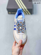 Top view showing the lace-up design, blue collar, textured overlays, and adidas tongue branding.