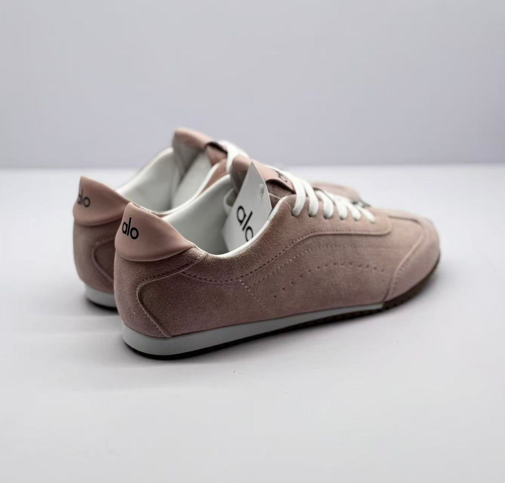 Rear three-quarter view showing the padded heel details and alo branding.