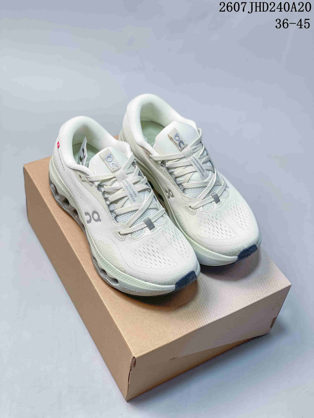 Pair of white On CloudTilt sneakers displayed on a shoebox, with style code 2607JHD240A20 and size range 36–45 visible above.