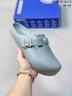 Light blue closed-toe buckle sandal shown at an angled front view.