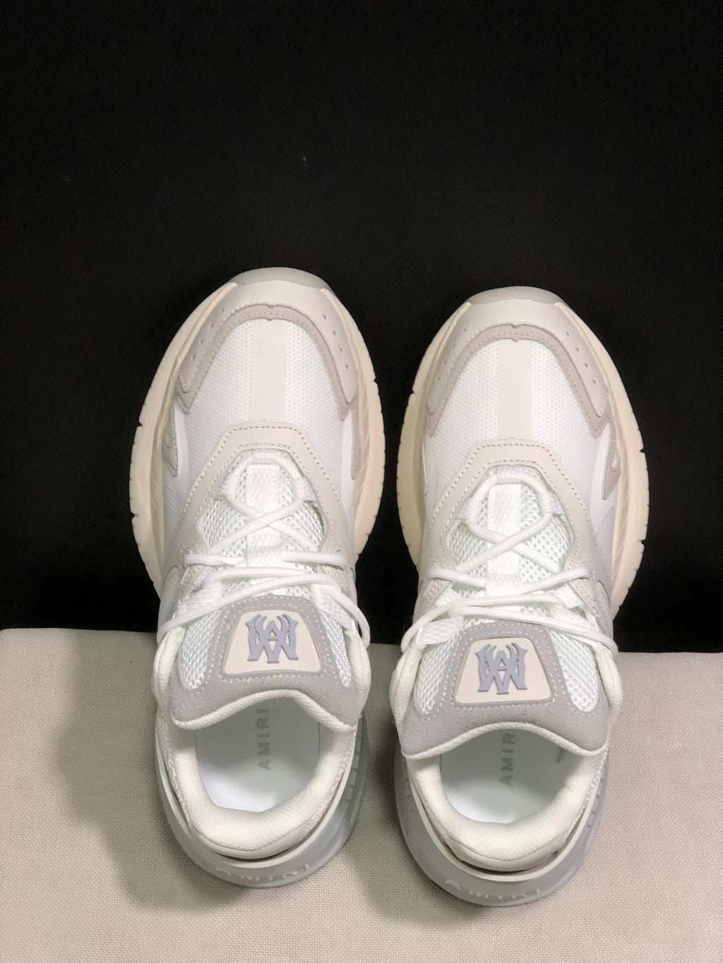 Top view showing the lace-up construction, layered panels and tongue branding.