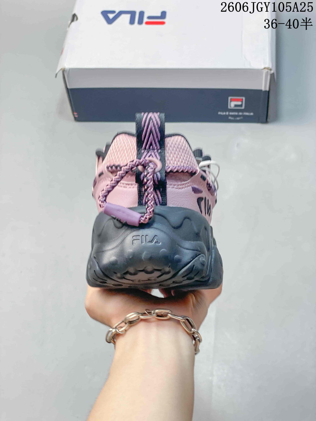 Rear view of the pink FILA Fusion sneaker showing the heel and pull tab.
