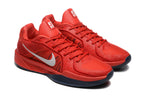 Pair of red Nike Sabrina basketball shoes shown at an angle.