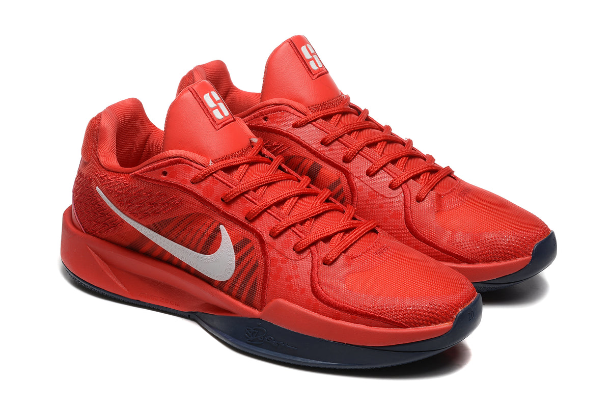 Pair of red Nike Sabrina basketball shoes shown at an angle.