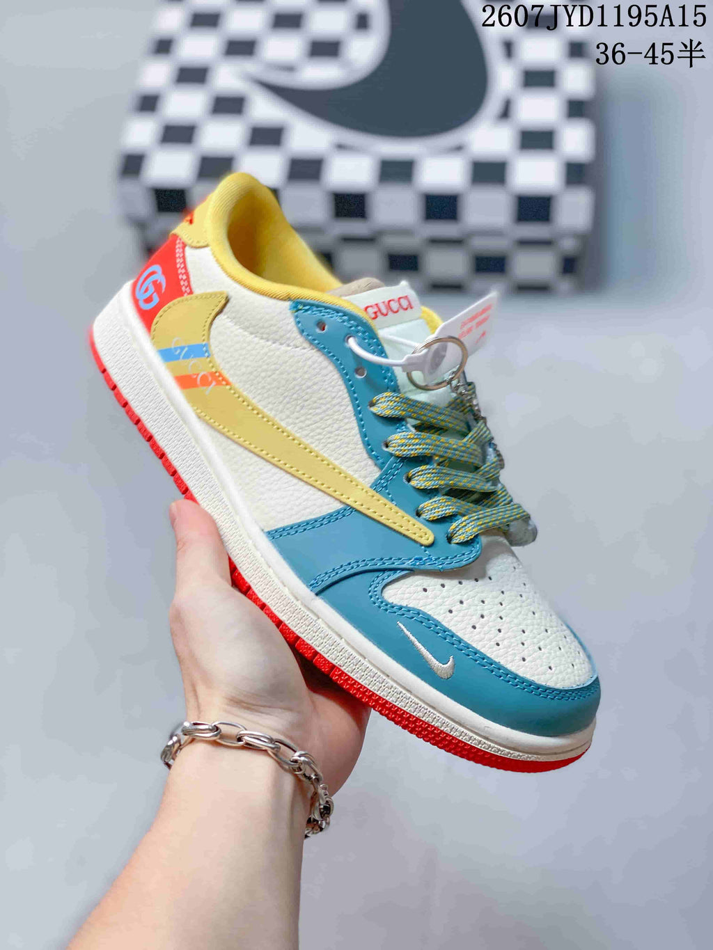 Side view of the white, teal, yellow and red colorway showing contrasting overlays, patterned laces and a red outsole.