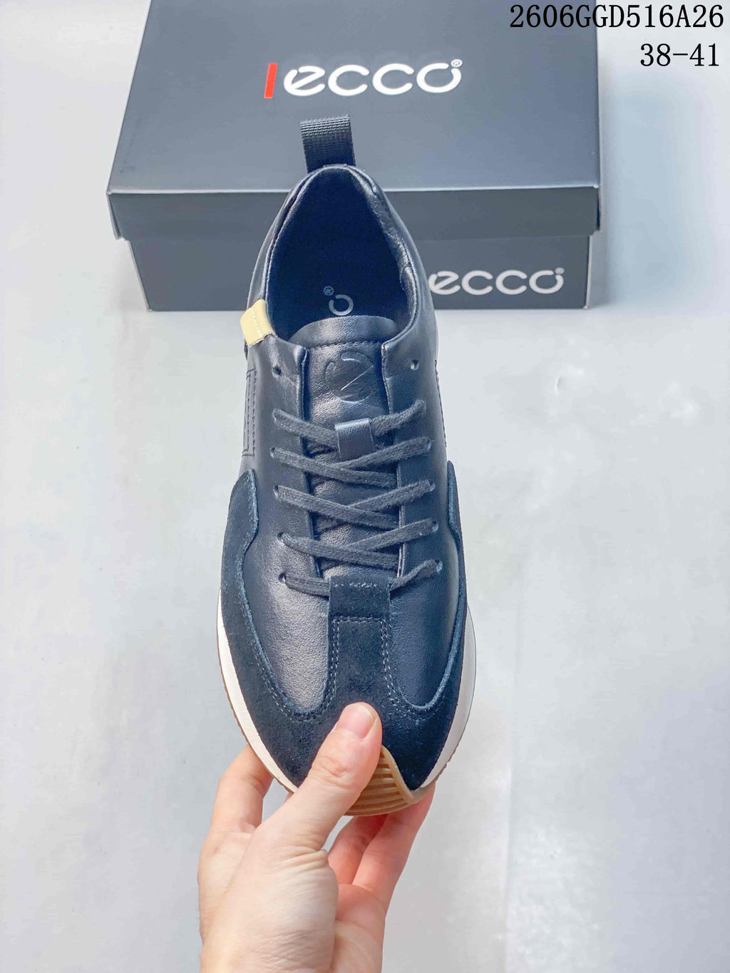 Top view of the navy lace-up sneaker and tongue