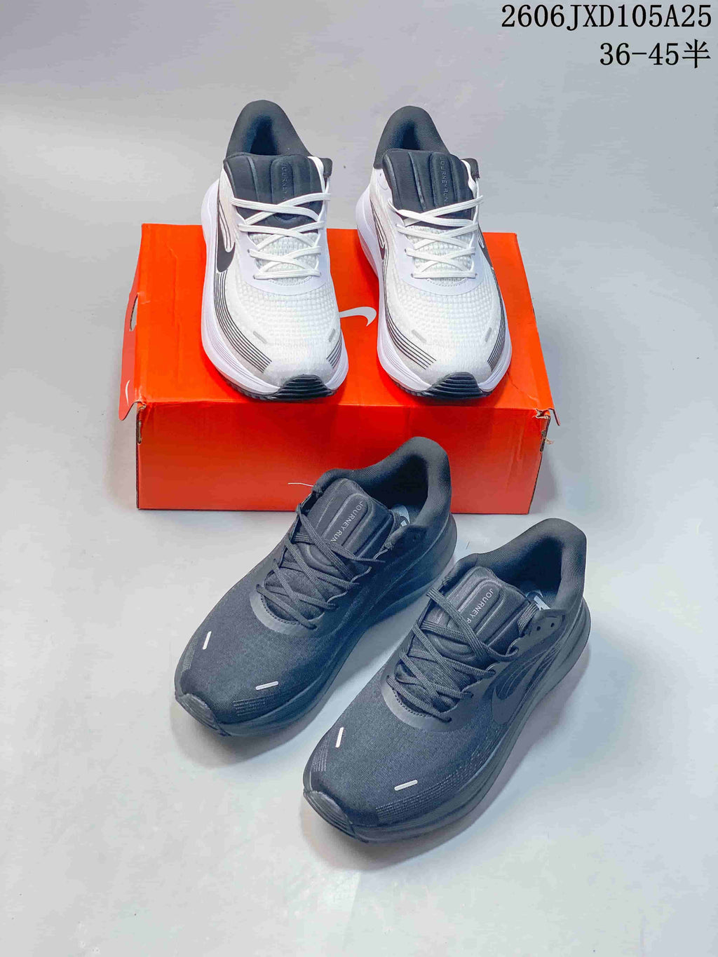 White and charcoal Nike Air Zoom Pegasus running shoes shown together.