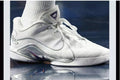 White and silver Nike LeBron 22 high-top basketball shoe shown from the side