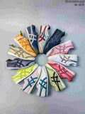 Collage showing multiple Onitsuka Tiger sneaker colorways arranged in a circle; style code 2510JGD291A22 and size range text are visible at the top right.