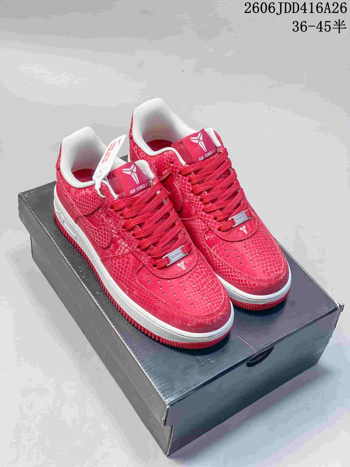 Pair of red patterned Nike Air Force 1 '07 low-top sneakers on a shoebox