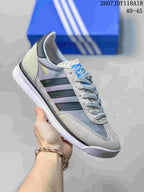 Gray adidas SL 72 sneaker with dark green and blue-gray stripes.