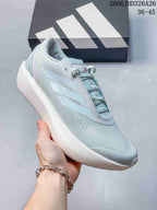 Angled side view of a pale blue running shoe with three-stripe branding