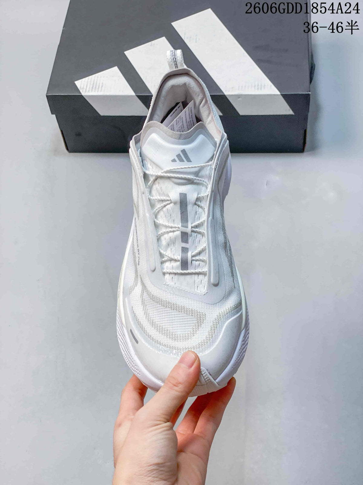 Top view of a white trail-running shoe with lace-up fastening