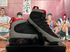 Pair of black and grey Jordan high-top sneakers with red accents, shown at an angle