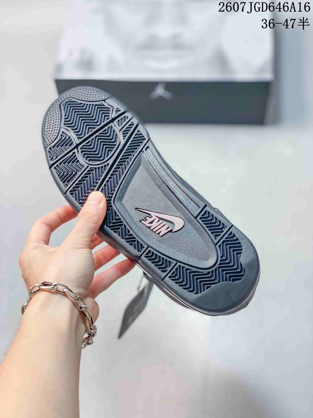Close-up of the patterned rubber outsole with a visible Nike mark.