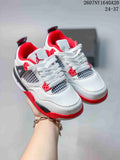 Pair of white Jordan children's sneakers with red and black accents, shown from an angled front view.