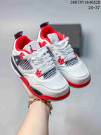 Pair of white Jordan children's sneakers with red and black accents, shown from an angled front view.