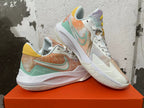 Pair of pastel multicolor Nike basketball shoes shown at an angle.