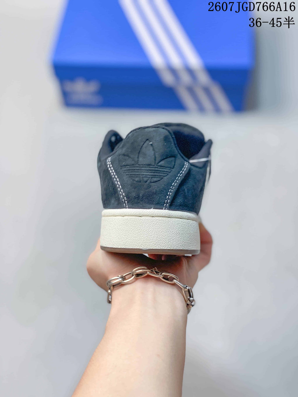 Rear view showing the black heel panels, white stitching, and white midsole.