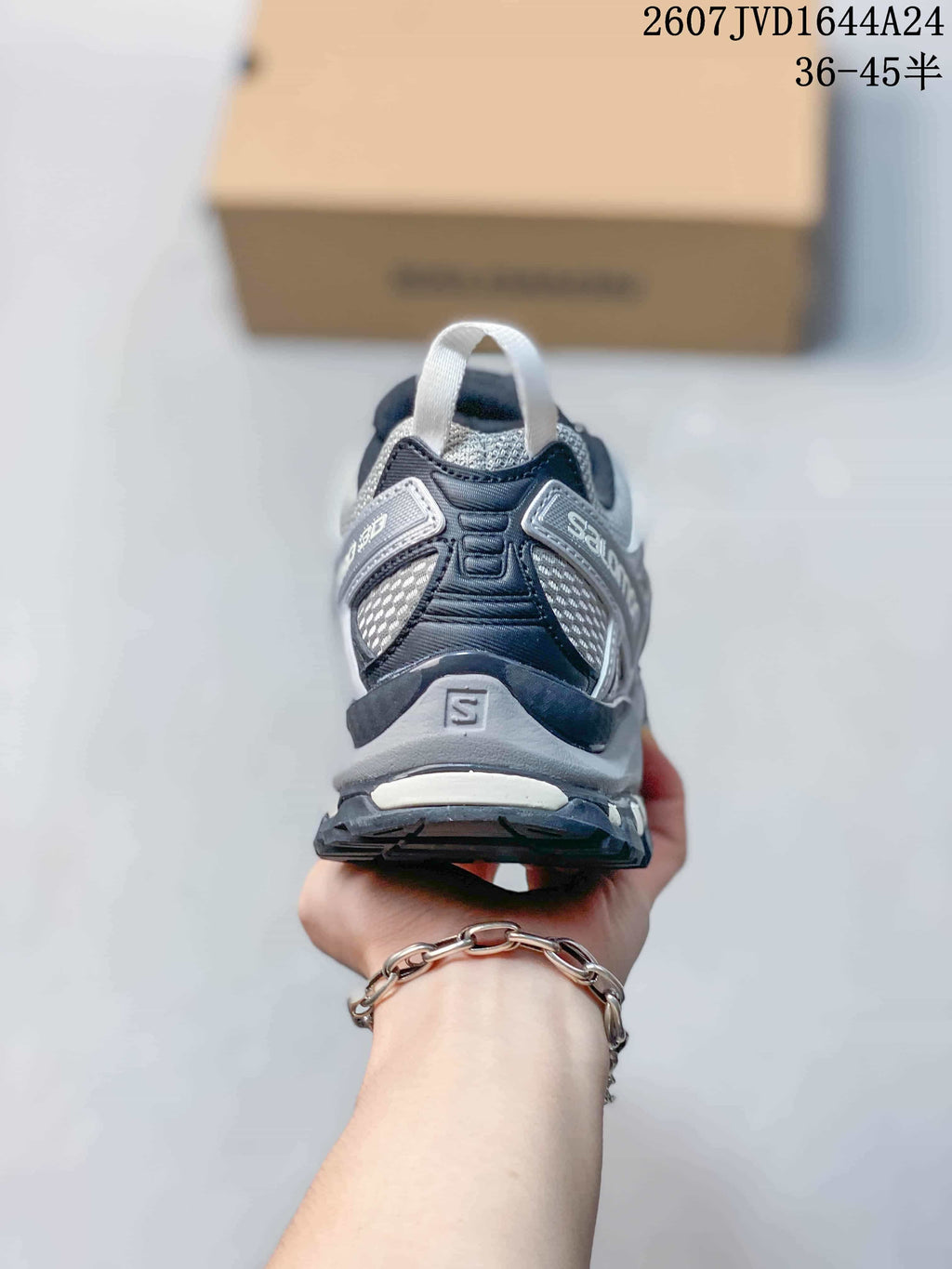 Rear view of the Salomon XA Pro 3D Seasonal sneaker showing the heel pull loop, layered heel structure, and outsole.