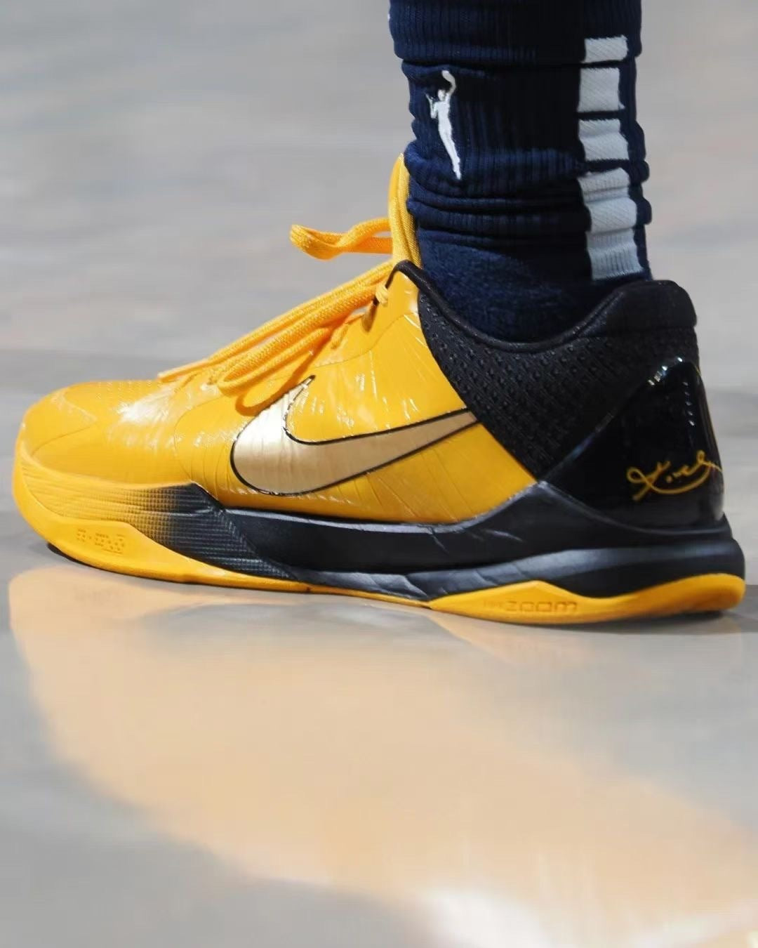 Close on-foot side view showing the Swoosh and heel detailing.