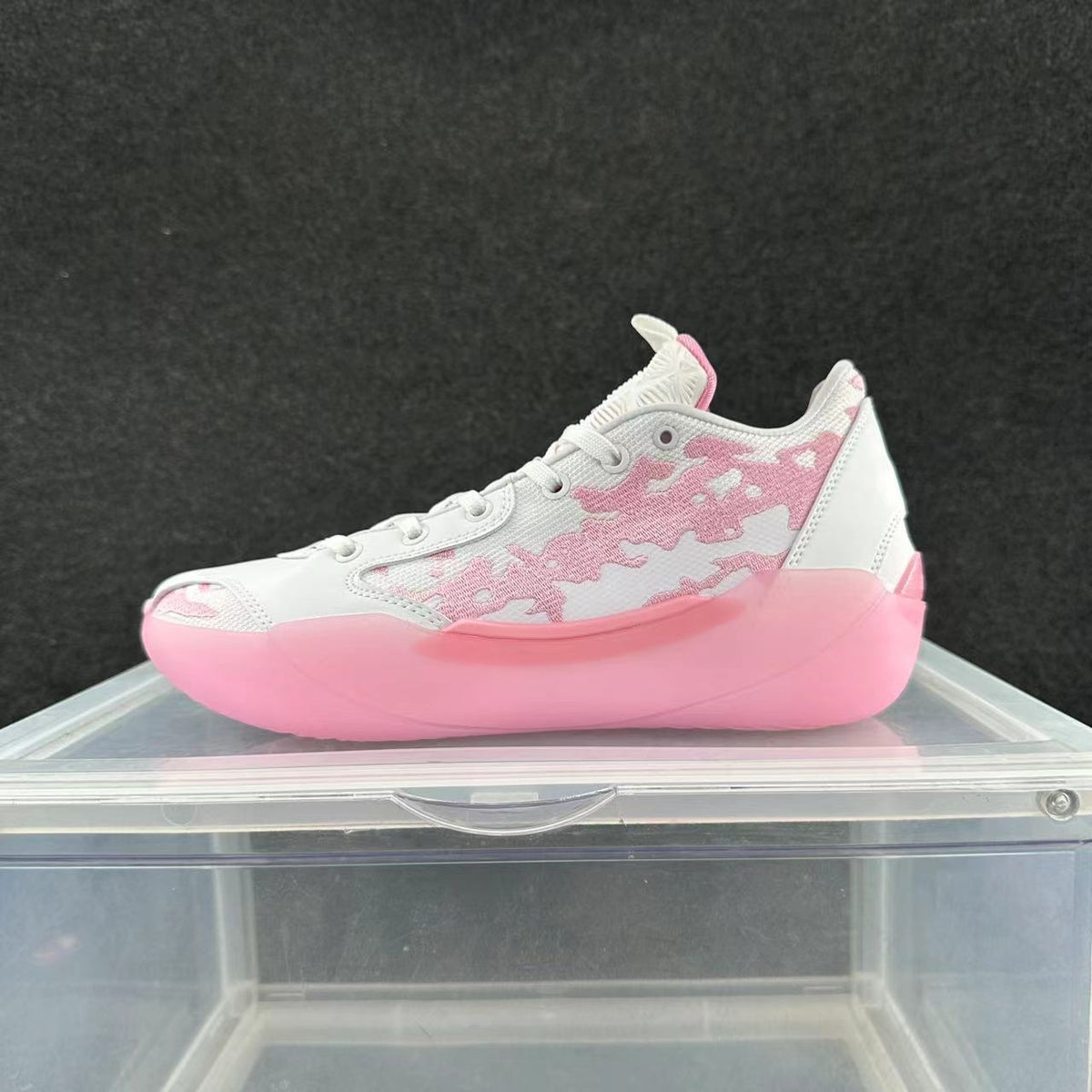 Side view of white and pink Jordan 39 basketball shoes