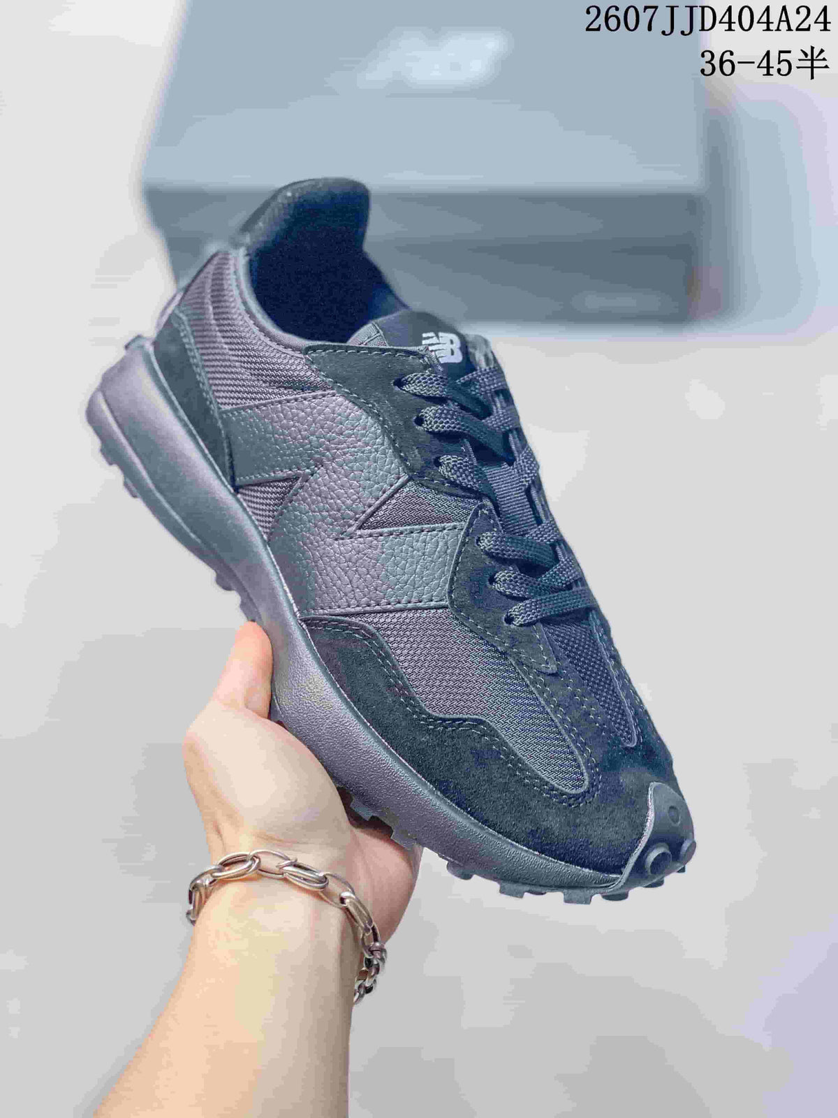 Angled side view of the black New Balance 327 sneaker