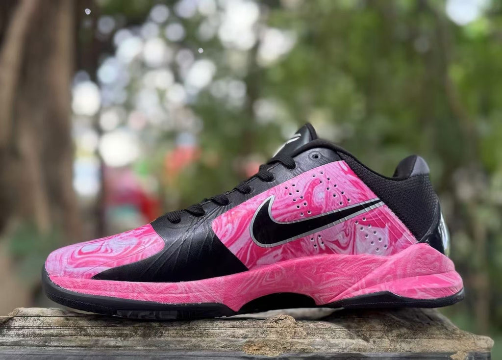 Opposite side view showing pink patterned panels and black accents