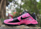 Opposite side view showing pink patterned panels and black accents