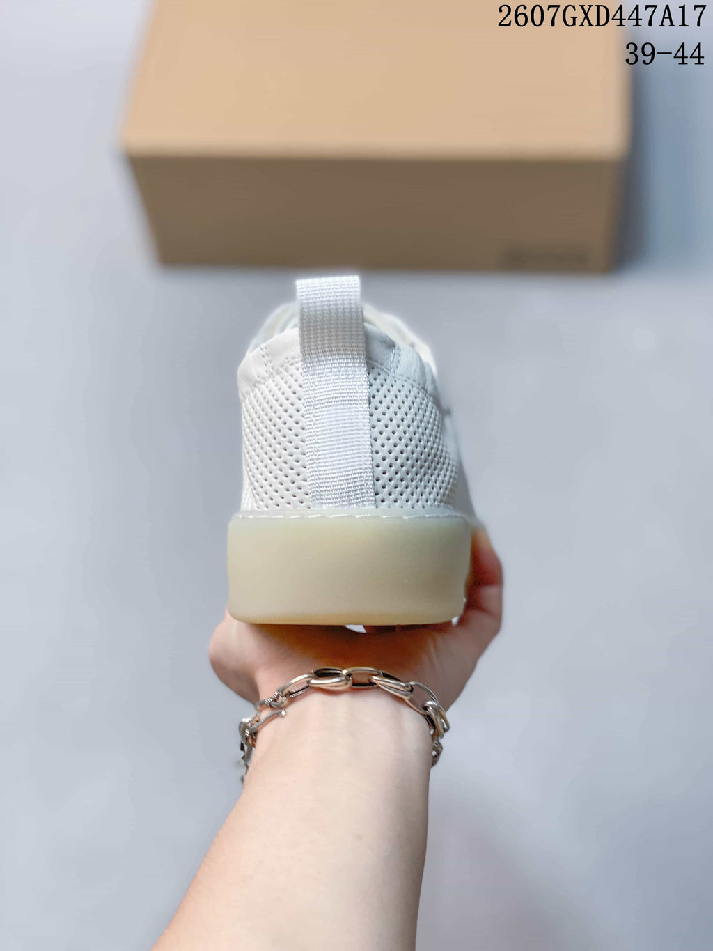 Rear view showing the perforated heel panels, pull tabs and translucent outsole.