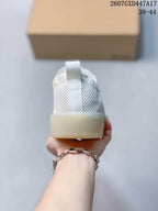 Rear view showing the perforated heel panels, pull tabs and translucent outsole.