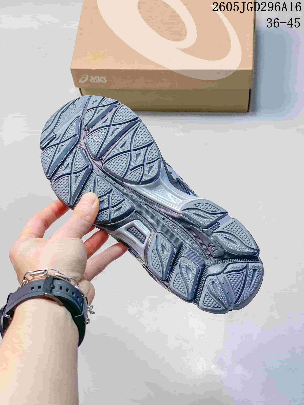 Close-up of the patterned outsole on an ASICS Gel-Cumulus 16 sneaker