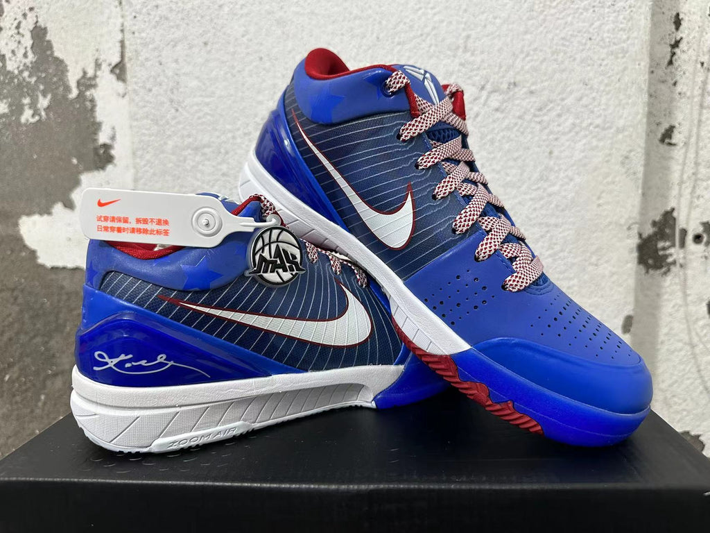 Angled view of blue Nike Kobe basketball shoes with red and white accents and patterned laces.