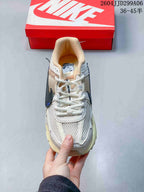 Top view of a Nike Zoom Vomero 5 sneaker showing the mesh-style toe, white laces, and padded collar.