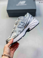 Side profile highlighting the large New Balance branding, mesh-look panels, and layered overlays.