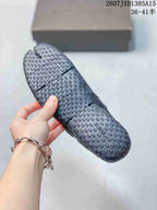 Underside view of a black Nike Air Rift shoe showing the textured, patterned outsole.