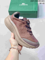 Mauve Lacoste lace-up sneaker with contrasting panels and green shoebox