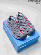 Pair of gray and pink HOKA Hopara sandals displayed on a blue shoebox.