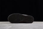 Underside view showing the black rubber outsole with circular traction grooves and segmented tread.