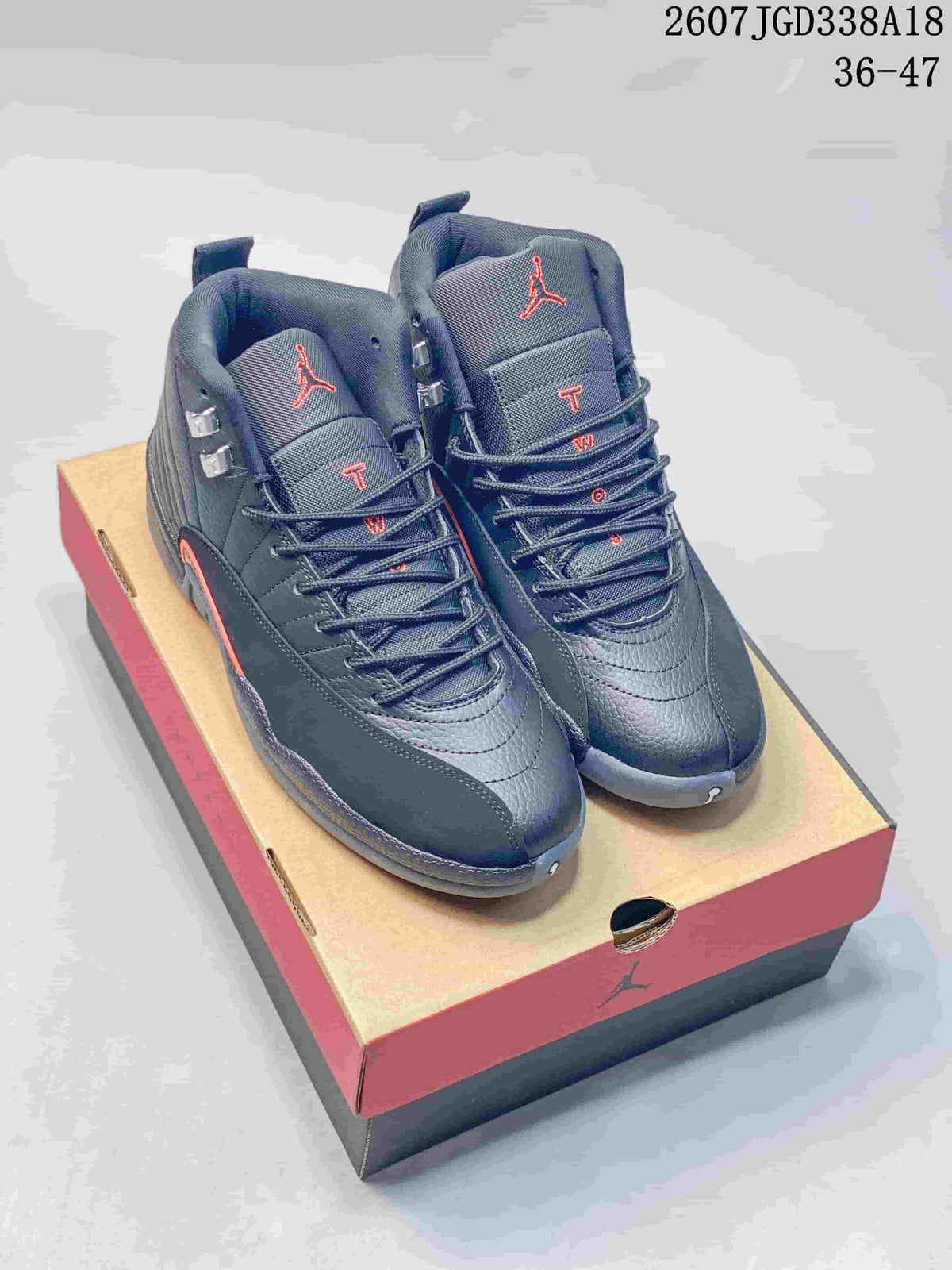 Black and red high-top Jordan sneakers displayed on a shoebox; overlay text shows style code 2607JGD338A18 and size range 36–47.