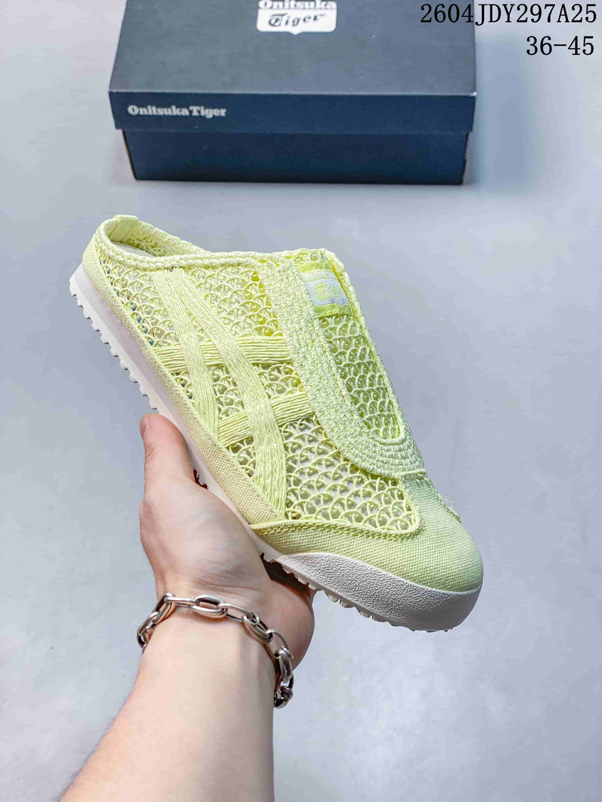 Pale lime green Onitsuka Tiger Mexico 66 Sabot slip-on sneaker with a tonal patterned upper.