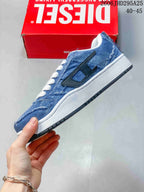 Side view of a blue denim-look sneaker with a black side accent and white midsole.