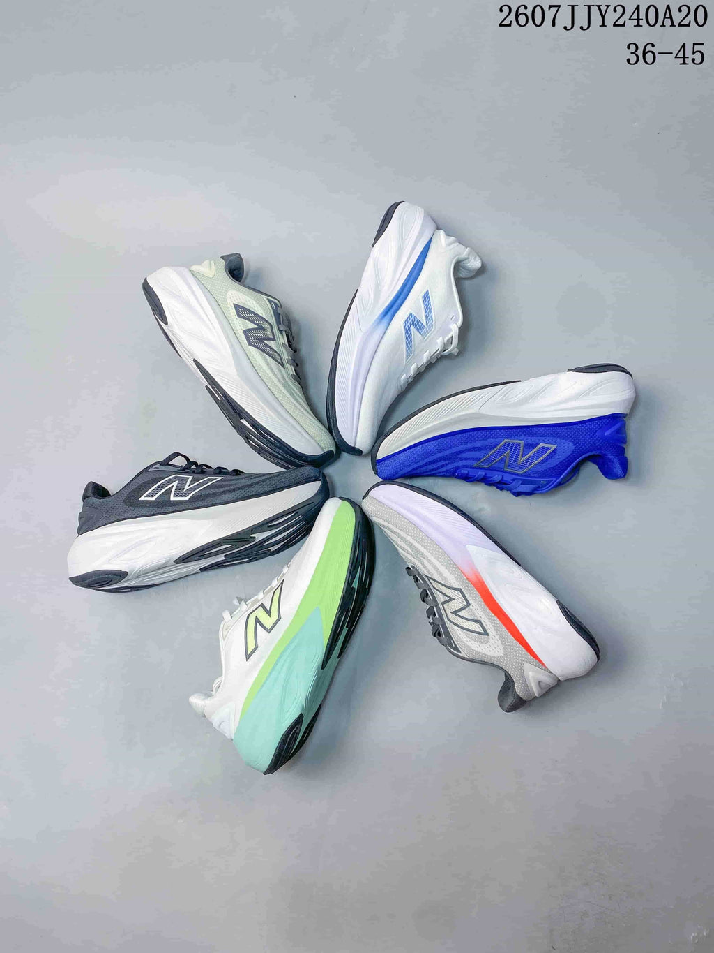 Overhead display of six New Balance running sneakers in blue, white, black, green, gray, and coral-accented color combinations.