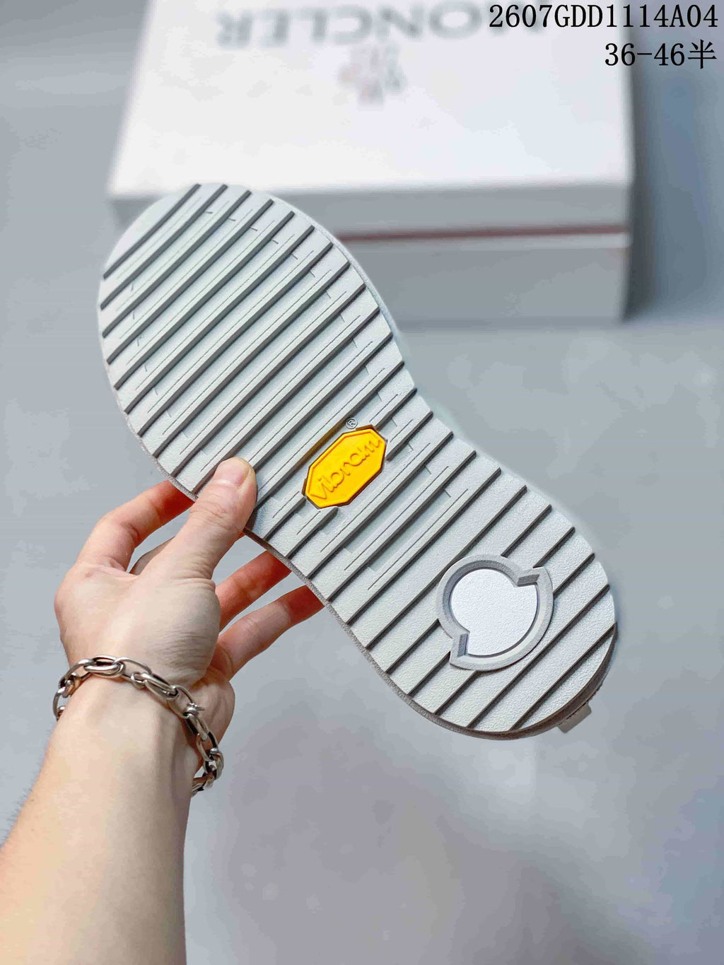 Close-up of the sneaker outsole showing a ribbed tread pattern and a yellow Vibram badge.