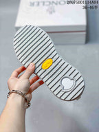 Close-up of the sneaker outsole showing a ribbed tread pattern and a yellow Vibram badge.
