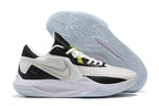 White and black basketball shoe with pale blue outsole details.